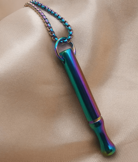 The Pause Kit pendant worn at the collarbone