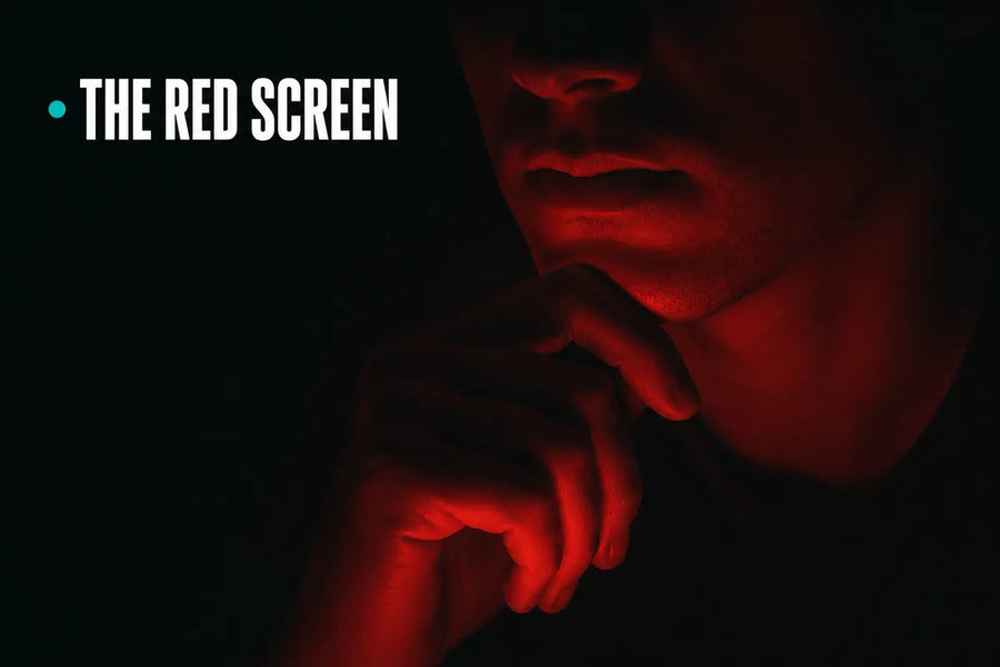 The red screen - a jaw and hand lit only by red chart light in the dark